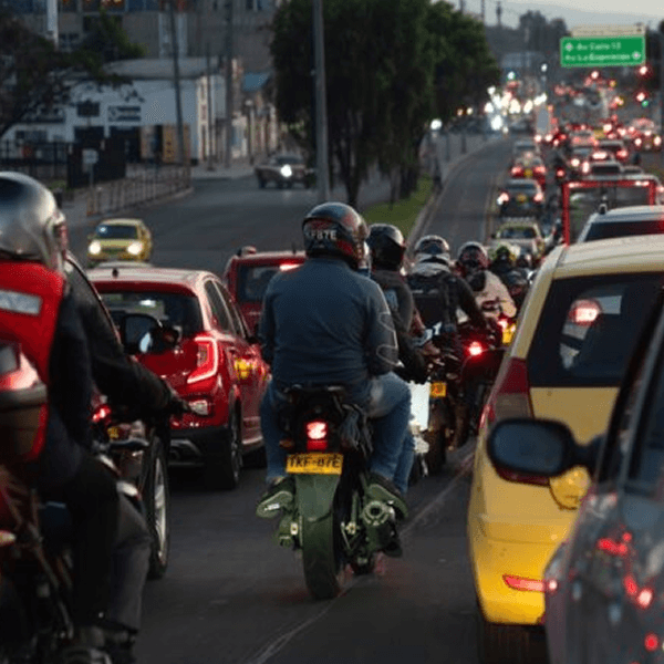 Urban traffic and motorcycles at dusk